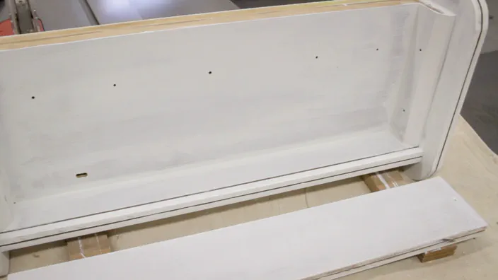 Paint primer is applied to the lightbox.