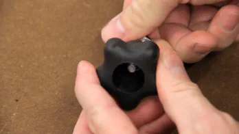 A plastic star knob and bolt.