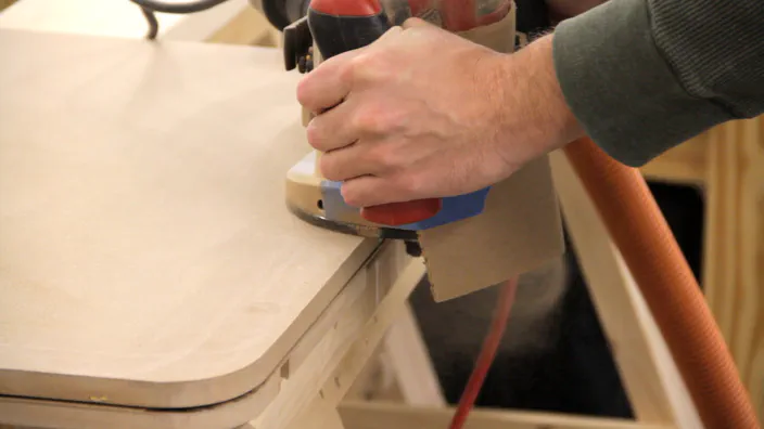 A router is used to route a slot in the edge of the table.