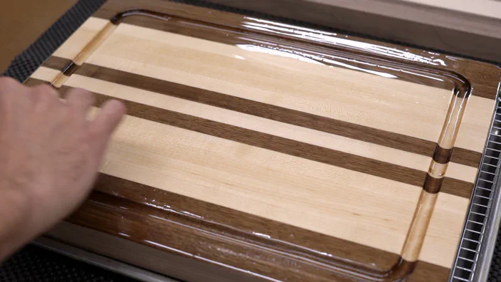 An edge grain cutting board with finish applied.