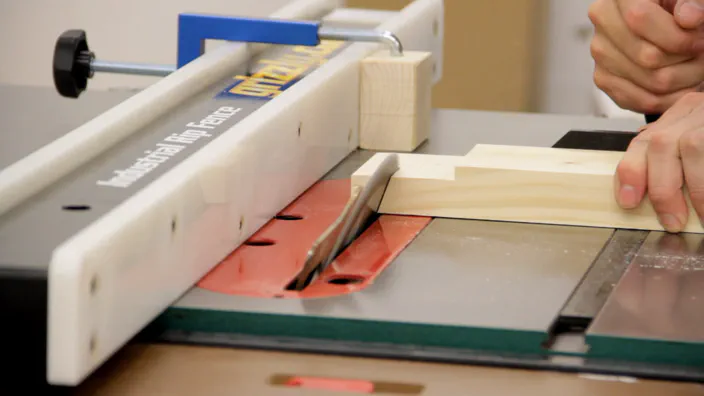 A table saw is used to cut a bevel.