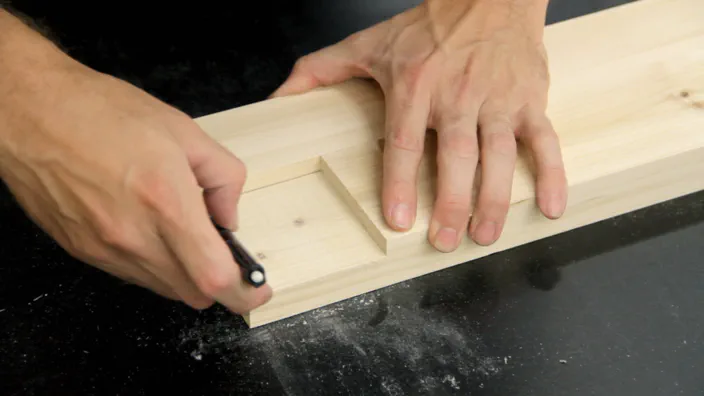 A pencil is used to mark the second half of a lap joint.