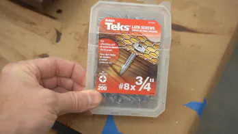 A box of three-quarter inch screws.