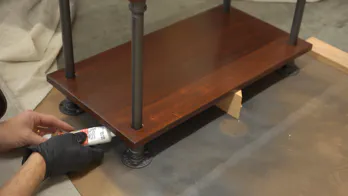 Caulk is applied to the leg couplings.