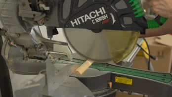 A miter saw trims the guide rail.