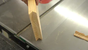 A miter saw trims the guide rail.