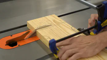 Ripping the guide rail at the table saw.