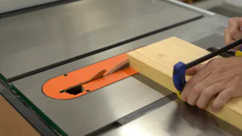 A miter saw trims the guide rail.