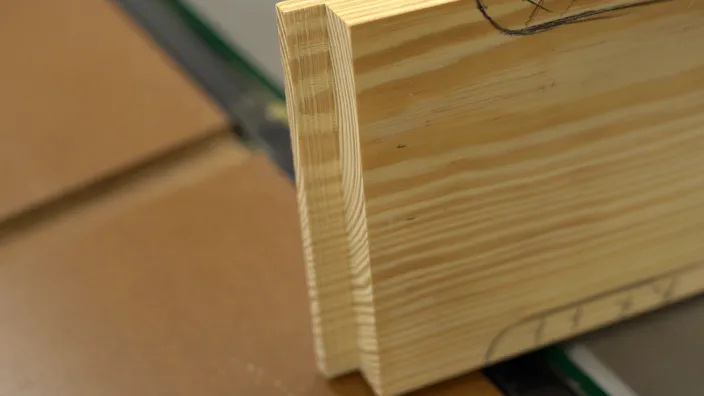 A miter saw trims the guide rail.