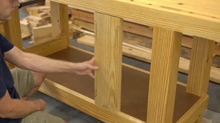 A miter saw trims the guide rail.