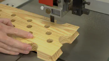 Ripping the guide rail at the table saw.