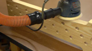 A miter saw trims the guide rail.