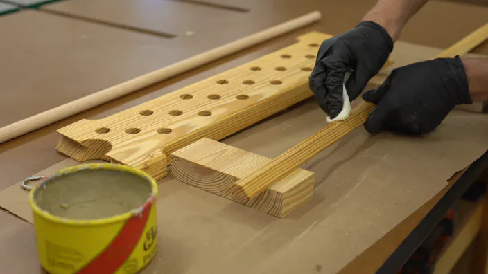 A miter saw trims the guide rail.