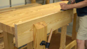 Ripping the guide rail at the table saw.