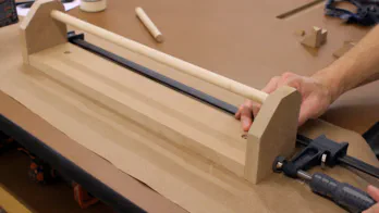 A clamp is used to secure the rack sides to the back.