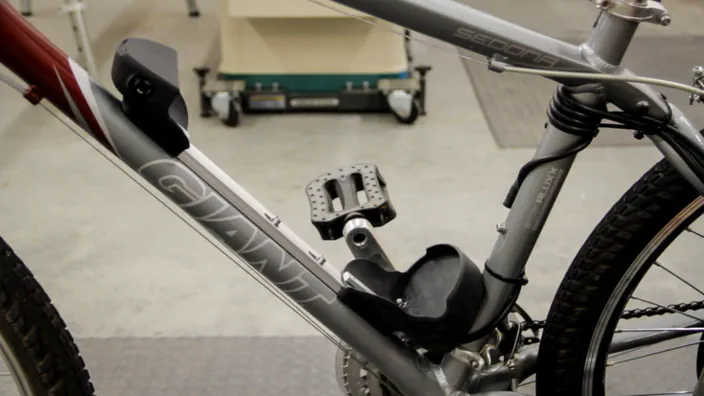 Wires from an electric bicycle motor are connected to the battery pack.