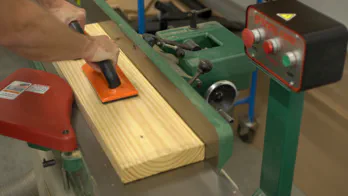 A jointer is used to flatten a board.