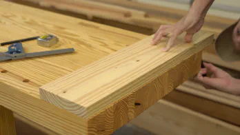 The width of the board is marked at the bench.
