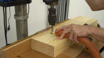 A hole is drilled in the jaws at the drill press.