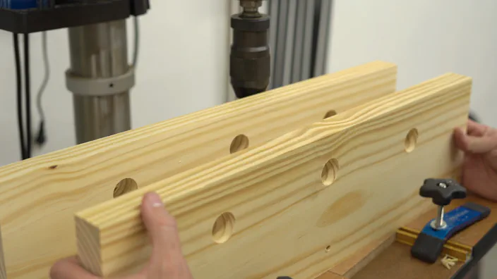 The jaws with holes drilled in them.