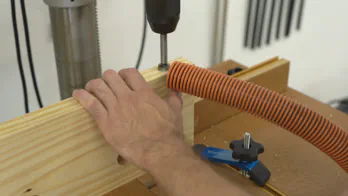 A dog hole is drilled into the outer jaw.