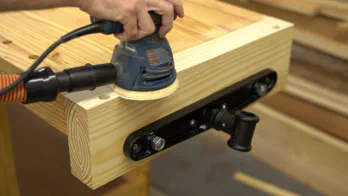 A random orbit sander is used.